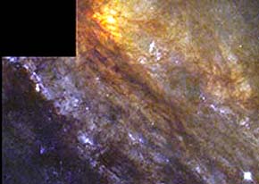 Close-up of part of the NGC253 developing spiral galaxy, showing the dust with hydrogen in this nebular agglomeration.